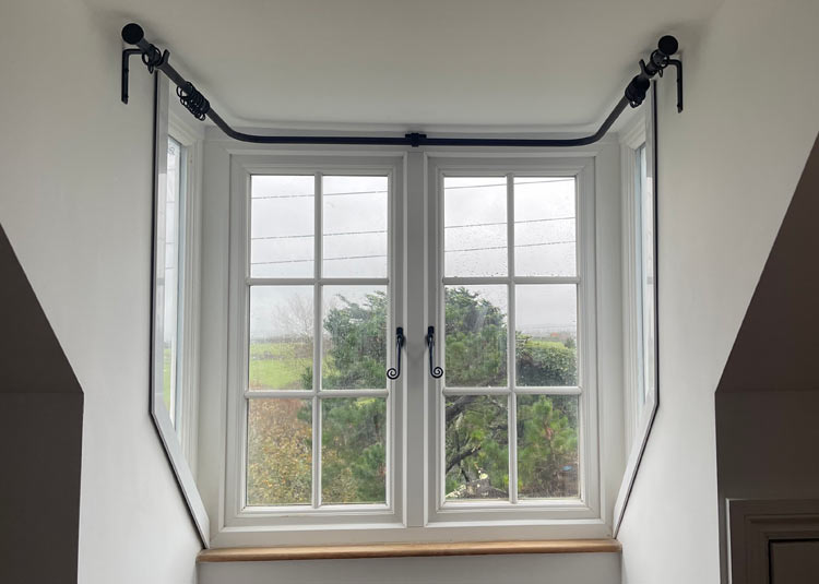 Bay window curtain pole in situ