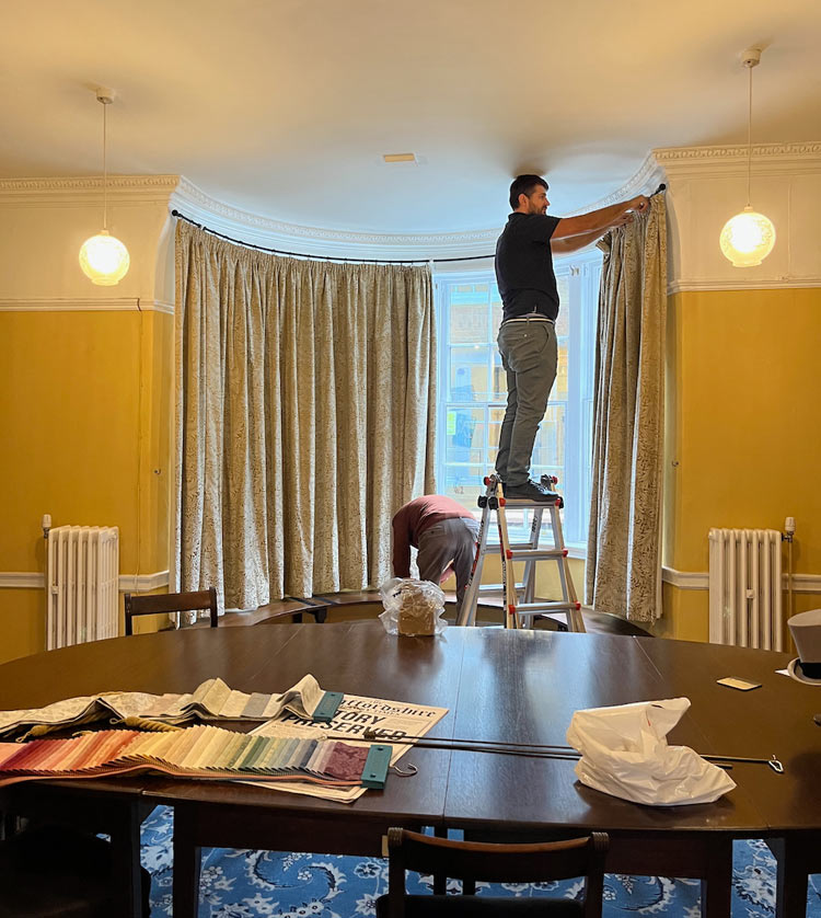 Customer's curved bay pole being installed at the Staffordshire History Centre